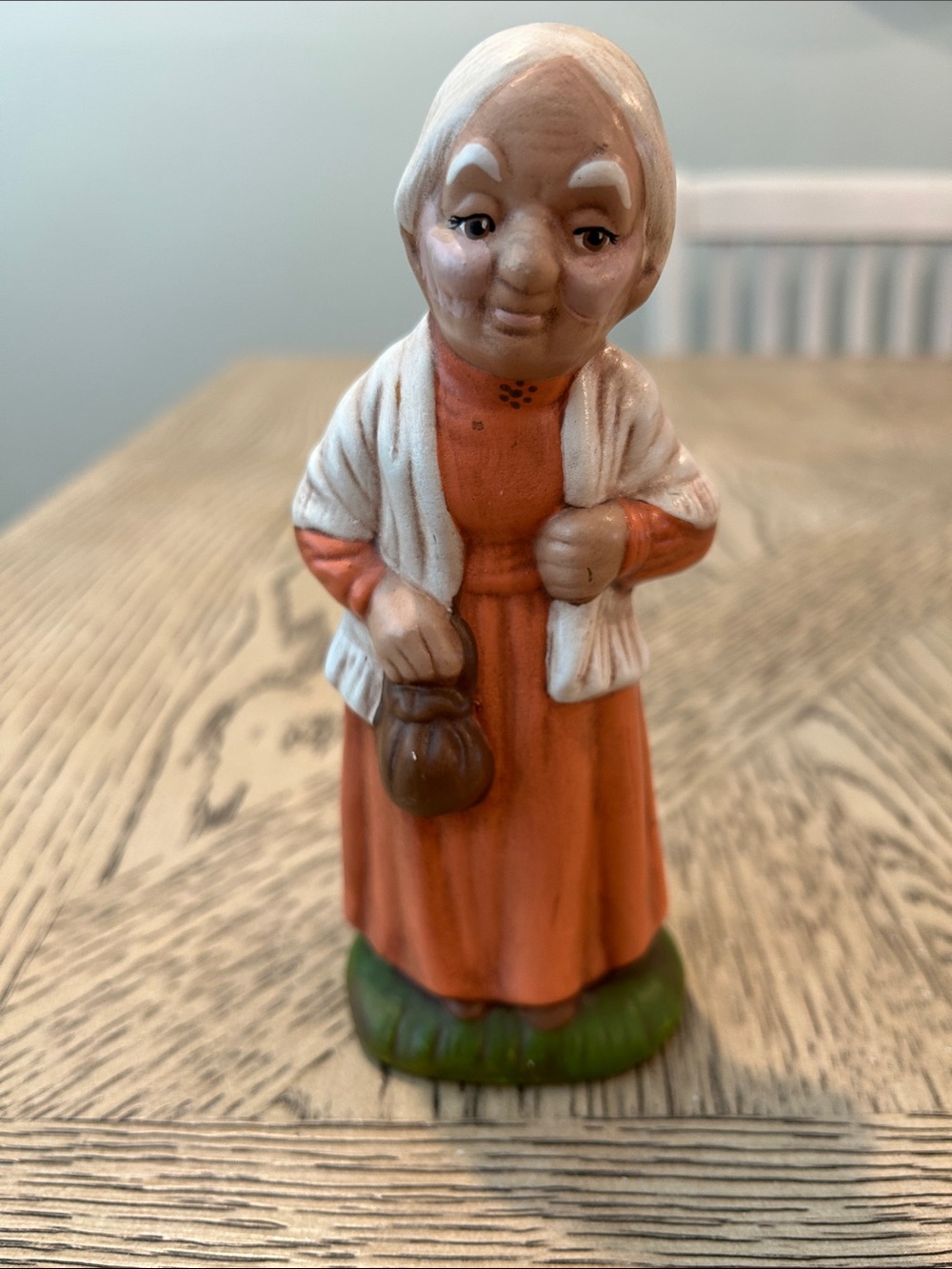 Vintage Figurine of Elderly Woman in Orange Dress